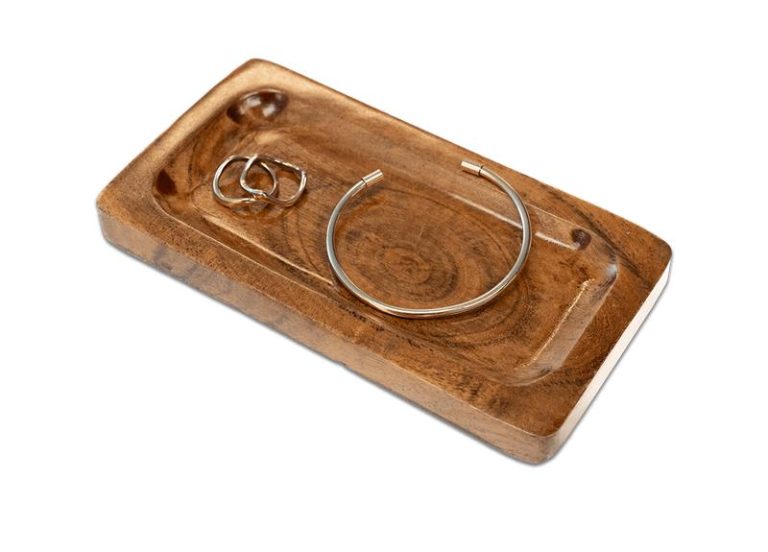 Rectangular wooden tray with a bracelet and 2 rings on it.